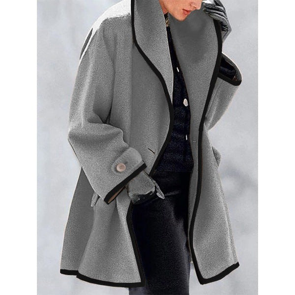 Stylish coat with contrasting piping