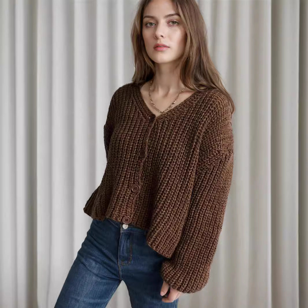 Damska bluza z grubego swetra z modnymi detalami guzików i luźnym krojem Eloura-Moda