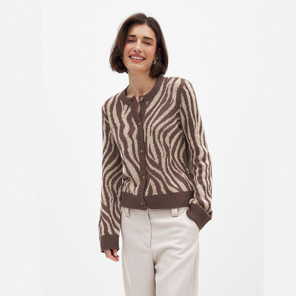 Damska bluza z eleganckim wzorem zebry i detalami guzikowymi Eloura-Moda