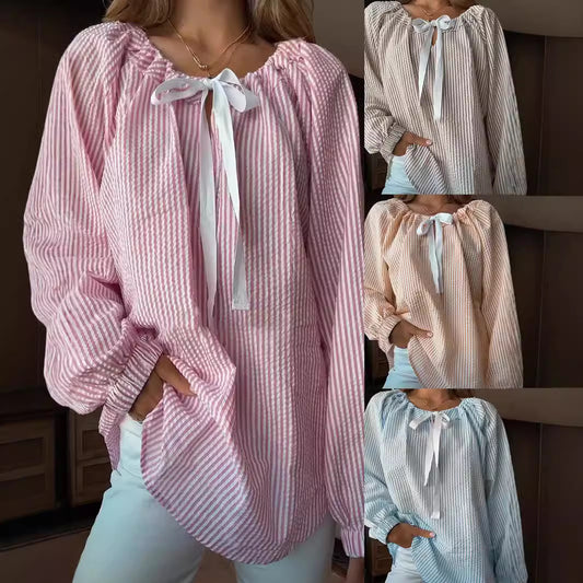 Damska bluzka z elastycznym dekoltem i wiązaniem w kokardę Eloura-Moda
