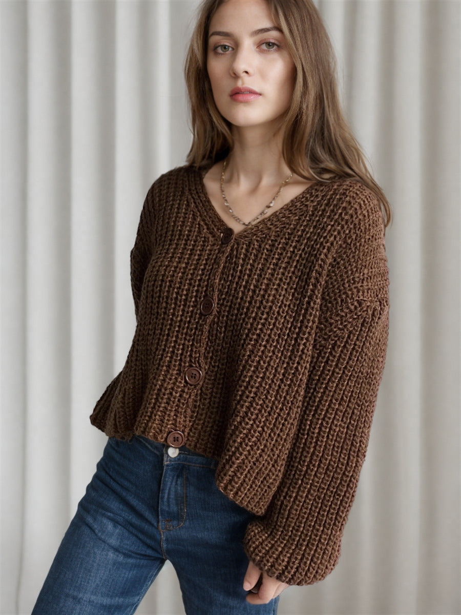 Damska bluza z grubego swetra z modnymi detalami guzików i luźnym krojem Eloura-Moda