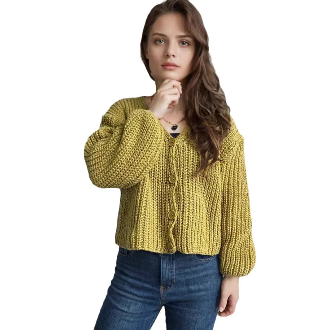 Damska bluza z grubego swetra z modnymi detalami guzików i luźnym krojem Eloura-Moda