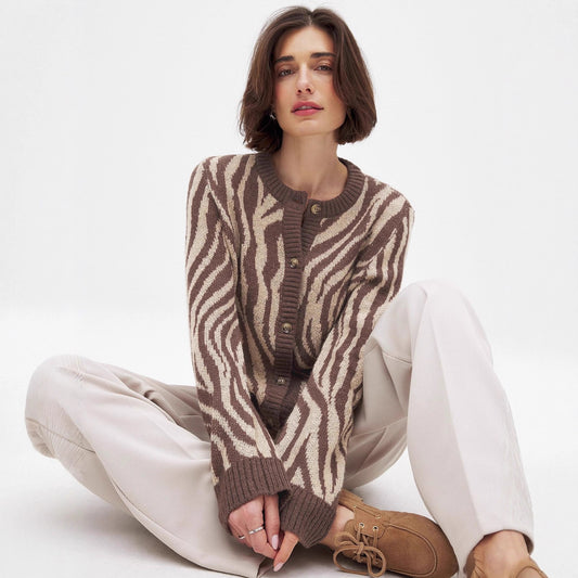 Damska bluza z eleganckim wzorem zebry i detalami guzikowymi Eloura-Moda