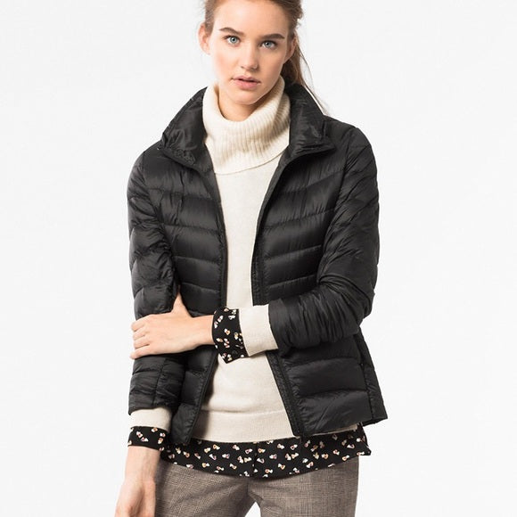 Light quilted jacket in navy color with a high collar