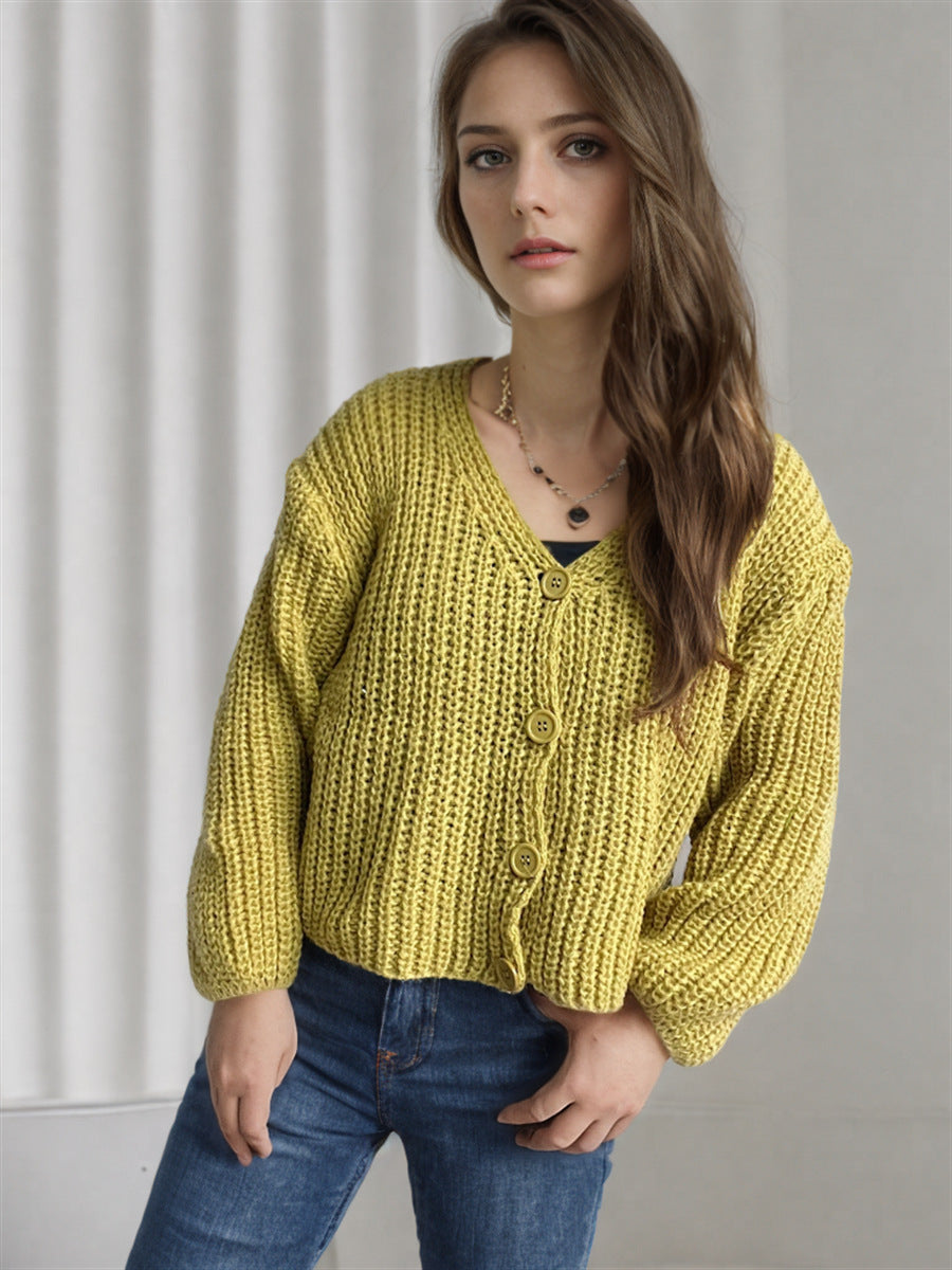 Damska bluza z grubego swetra z modnymi detalami guzików i luźnym krojem Eloura-Moda