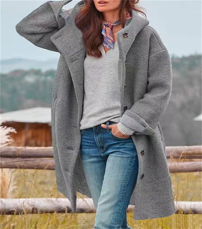 Women's oversized wool coat with a practical button closure Eloura-Moda