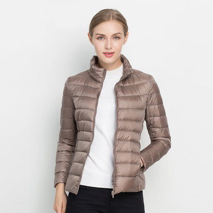 Light quilted jacket in navy color with a high collar
