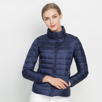 Light quilted jacket in navy color with a high collar